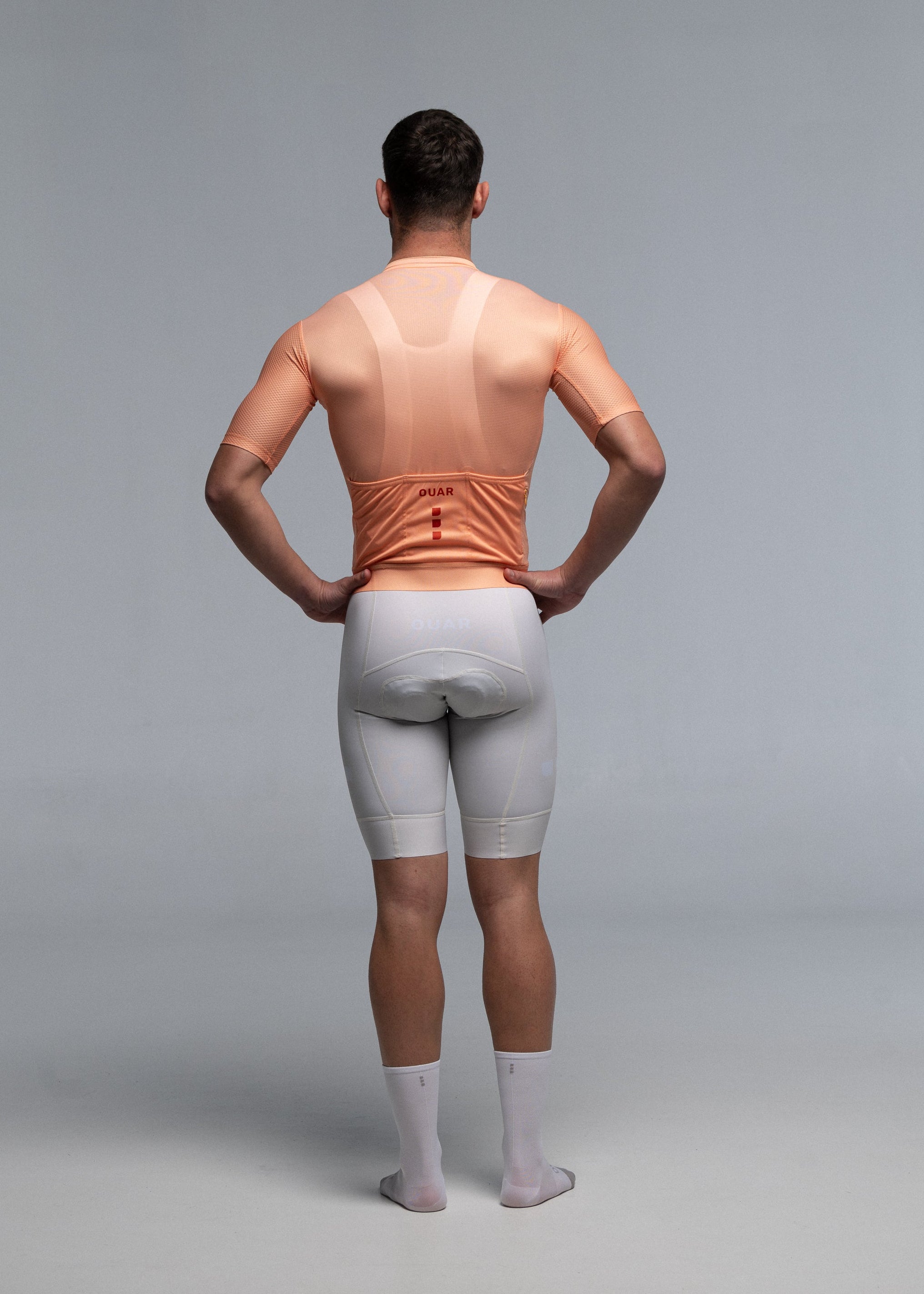 PEACH JERSEY + OFF WHITE BIBS + WHITE/GREY SOCKS
