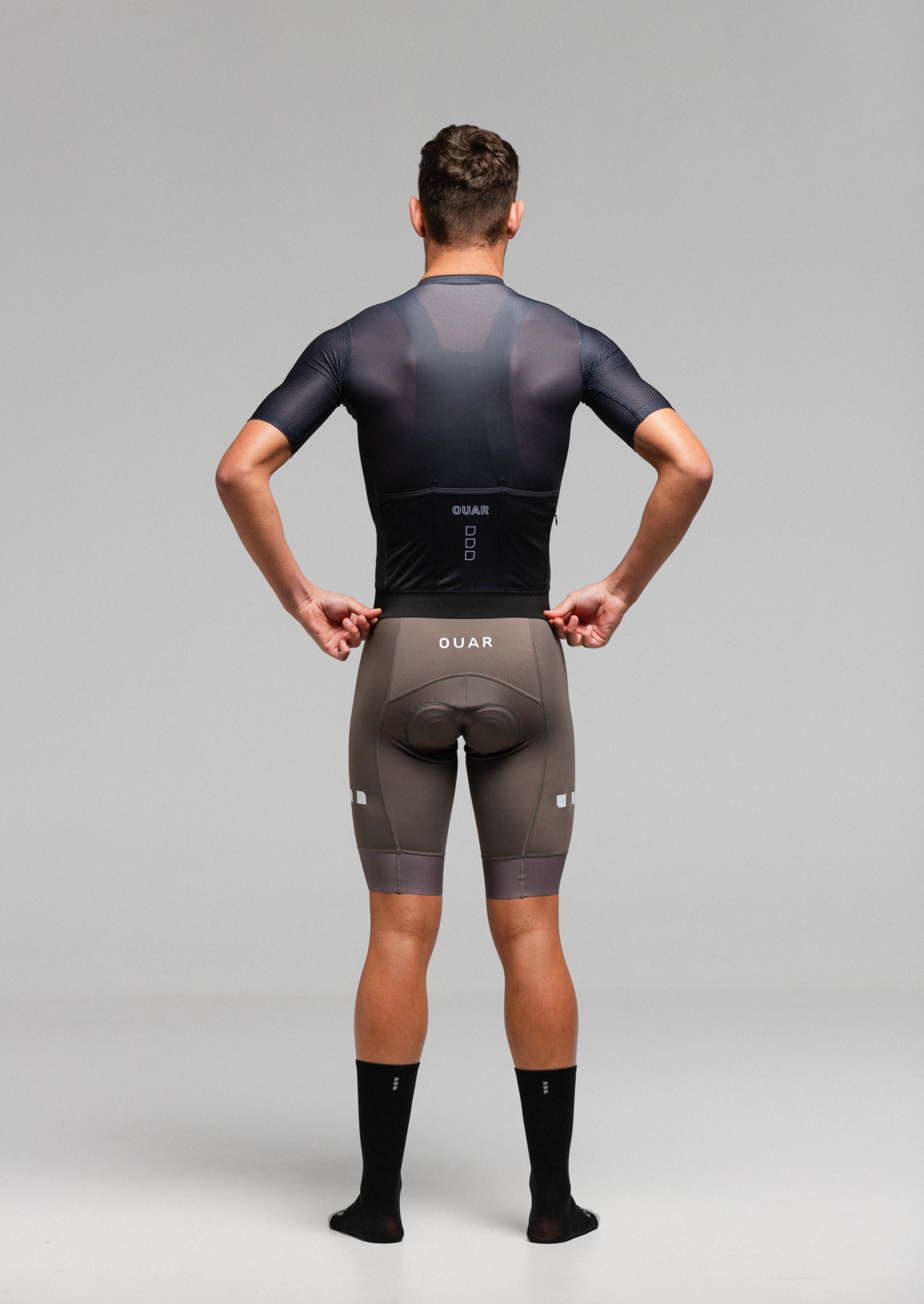 PURE BLACK JERSEY + STONE EVO BIBS + BLACK/GREY SOCKS